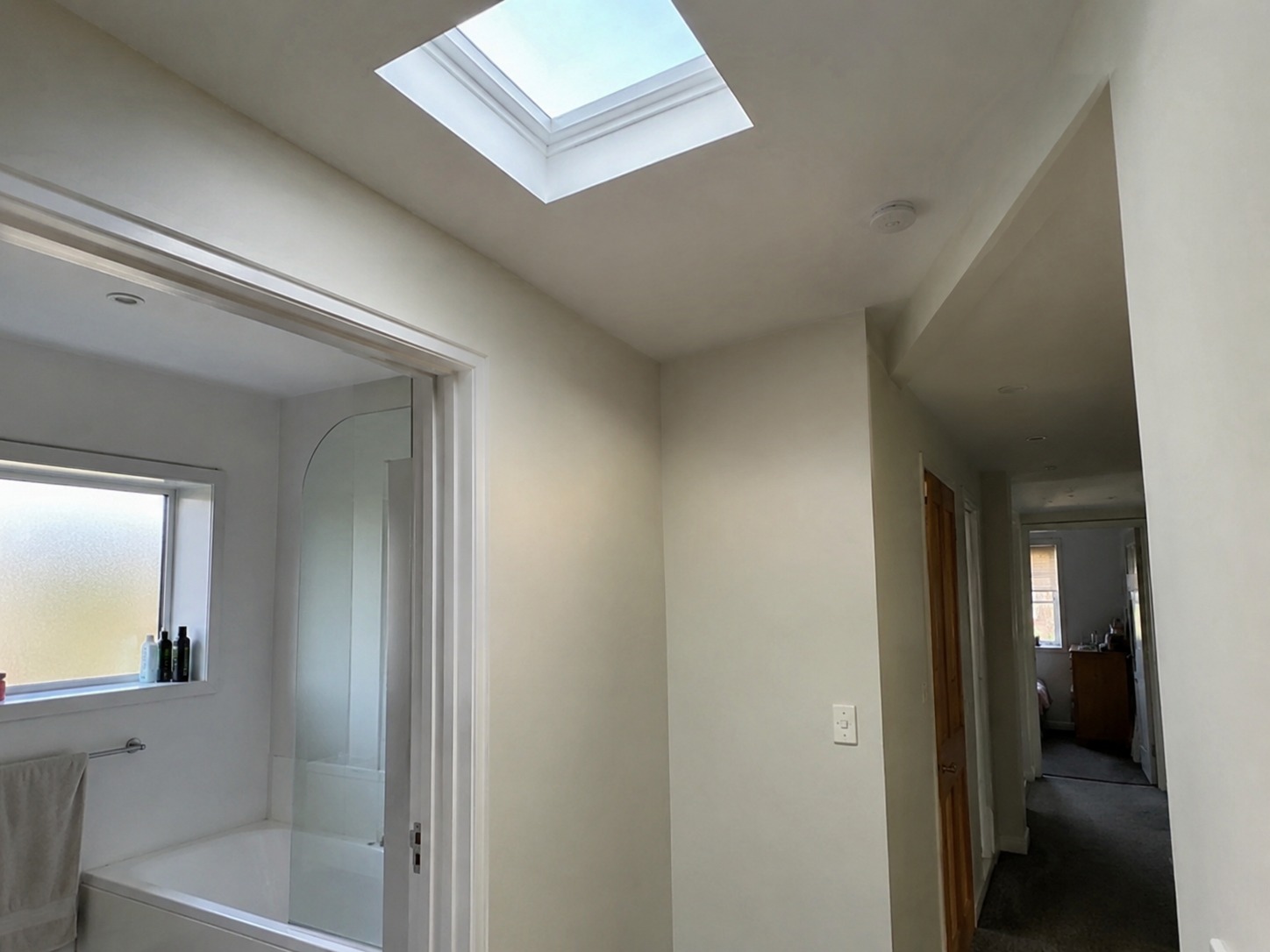 natural light from a ceiling skylight in a Whangarei hallway and bathroom